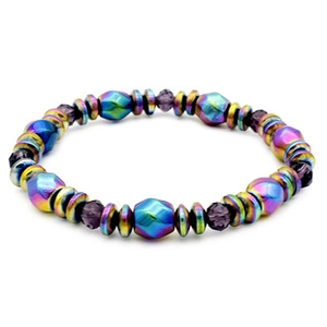 Macro detail of rainbow hematite beaded bracelet with faceted iridescent finish