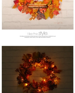 Autumn maple leaf wreath with berries, pumpkins and LED lights for festive home decoration