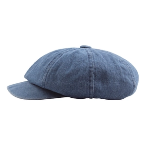 Classic dark blue denim newsboy cap featuring eight-piece panels and a short brim