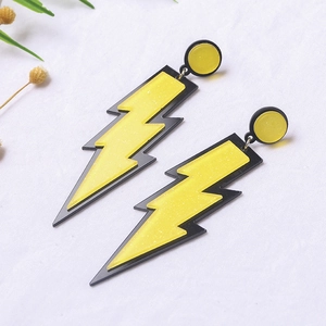 Fashionable oversized acrylic lightning bolt earrings in yellow and black glitter finish