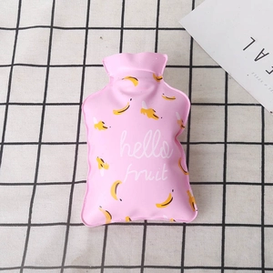 Pink PVC hot water bottle with banana pattern on a black and white checkered fabric