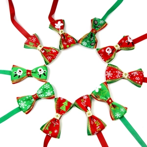 Detailed view of adjustable Christmas pet bow ties with red and green holiday patterns