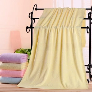 Close-up of soft microfiber towel featuring embossed bear and heart patterns in yellow