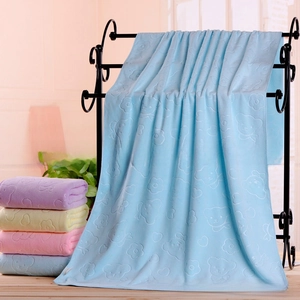 Detail of embossed bear pattern on soft absorbent microfiber bath towels in pastel colors
