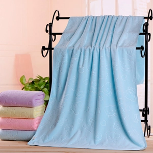 Detail of soft microfiber bath towel with embossed bear pattern in various colors