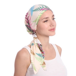Detail of soft milk silk fabric headwrap featuring colorful fern leaf patterns for women