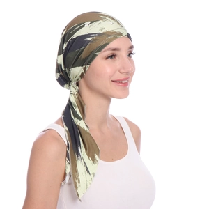 Detail view of the camouflage print headwrap showing the knitted texture and long strap ties