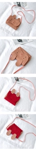 Detail of cute rabbit crossbody kids bags in pink and red lychee grain leather