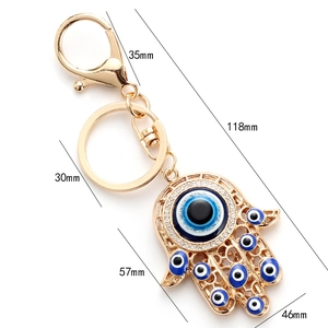 Detailed dimensions of the golden Hamsa Hand keychain with blue evil eye beads and crystals