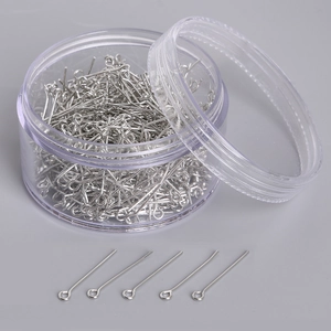 Silver jewelry eye pins in a round clear plastic box for DIY earring accessory making