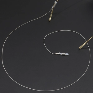 Silver thin metal chain eyeglass strap with adjustable white silicone anti-slip ends
