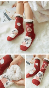 Detail of warm winter slipper socks featuring cute sheep patterns and fluffy fleece lining