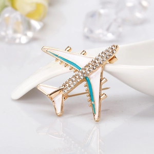 Cartoon airplane brooch in gold finish with blue enamel and sparkling crystal rhinestones