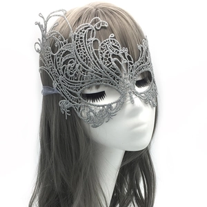 Detailed view of silver intricate lace eye mask with delicate embroidery for masquerade parties