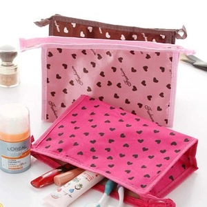 Three-piece heart-patterned PU leather cosmetic bags in brown, pink, and rose red colors