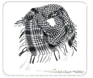 Detailed view of black and white checkered tactical scarf with fringe trim accents