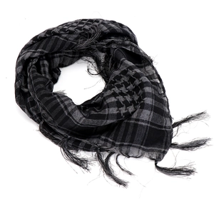 Detail of black and gray checkered tactical scarf showing woven fabric and fringe