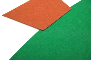 Detail showing the orange-brown and green non-woven felt fabric texture for calendars