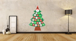 Detail of felt Christmas tree advent calendar with 24 numbered pockets on a textured wall