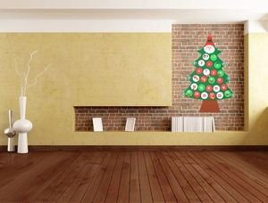 Christmas tree countdown calendar in green felt with 24 pockets on a brick wall