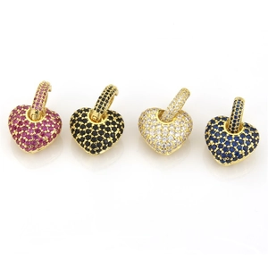 Detail of four multi-colored zircon heart charms in gold finish with micro-pave setting
