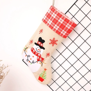 Linen Christmas stocking with snowman embroidery and red plaid cuff for holiday decor