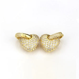 Detail of gold heart hoop earrings with micro-pave cubic zirconia crystals