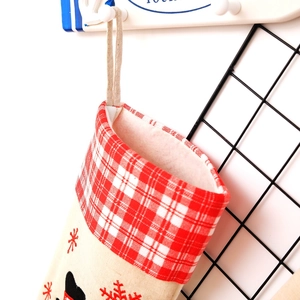 Linen Christmas stocking with Santa embroidery and red plaid cuff for tree decoration