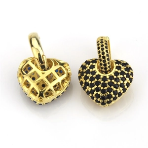Detail of heart pendant with black cubic zirconia micro-paving and golden metal back