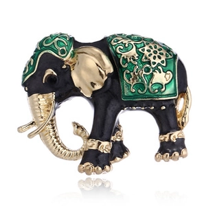Detailed view of the enamel elephant brooch with black and green finish and golden accents