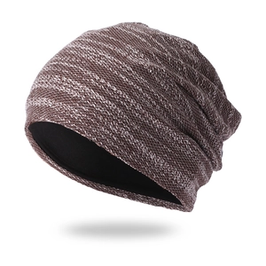 Detailed view of striped knit beanie with thick warm black lining for winter comfort