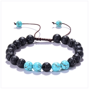 Détails de perles de lave et turquoise de 8mm sur un bracelet tressé et ajustable