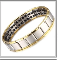 Close-up of gold and silver plated health bracelet showing magnetic inserts on inner band