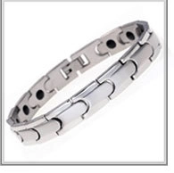 Detailed view of silver magnetic health bracelet with black magnets on inner metal links
