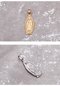 Detail of religious Virgin of Guadalupe pendants in gold and silver plating