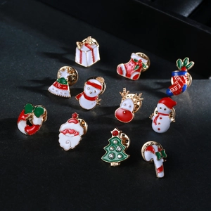 Detail of 11-piece Christmas enamel brooch set with reindeer and tree motifs on black