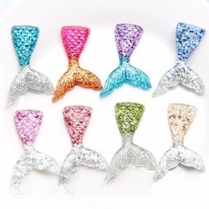 Macro detail of resin fish tail charms with sequins and size measurement 2.9x4.5cm