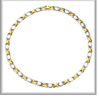 Detail view of the dual-tone gold X-link and silver oval bead textured necklace chain