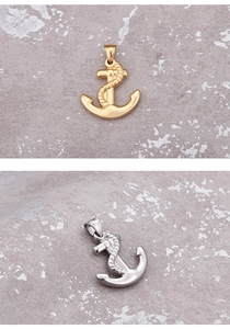 Detail of nautical anchor pendants in gold and silver finish with metallic luster
