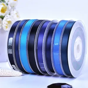 Multiple shades of blue polyester satin ribbon rolls for gift wrapping and floral crafts