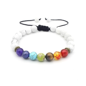 Detail of adjustable 7 chakra healing bracelet with white marble beads and bronze spacers