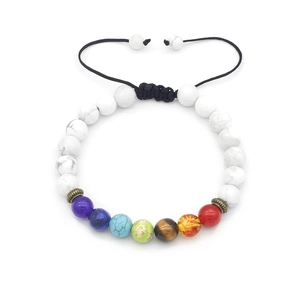 Detail of adjustable chakra bead bracelet with lava stones and colorful energy beads