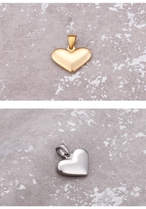 Polished stainless steel heart-shaped pendants in gold and silver finishes
