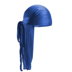Detail of royal blue silky satin durag with long tails and smooth glossy fabric texture