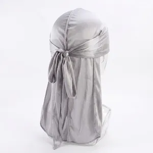 Silver satin durag featuring a glossy finish and premium stitching on the long tail