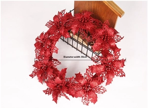 Close-up of 30cm red glitter poinsettia wreath with sequin finish for Christmas decor