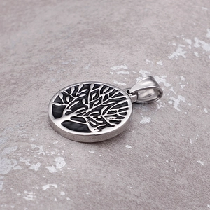 Silver stainless steel round tree of life pendant with black engraving on textured background