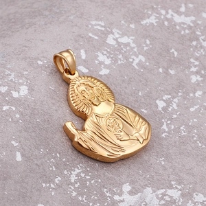 Golden Sacred Heart of Jesus pendant in titanium steel on stone background