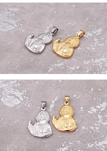 Detailed close-up of religious portrait pendants in polished gold and silver steel finish