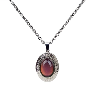 Vintage oval locket necklace with floral relief and color-changing gemstone on O-chain